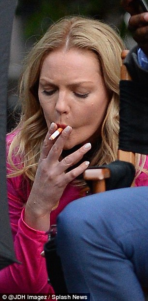 She's also been caught smoking cigarettes (pictured, in 2015), though she's said she tried to quit