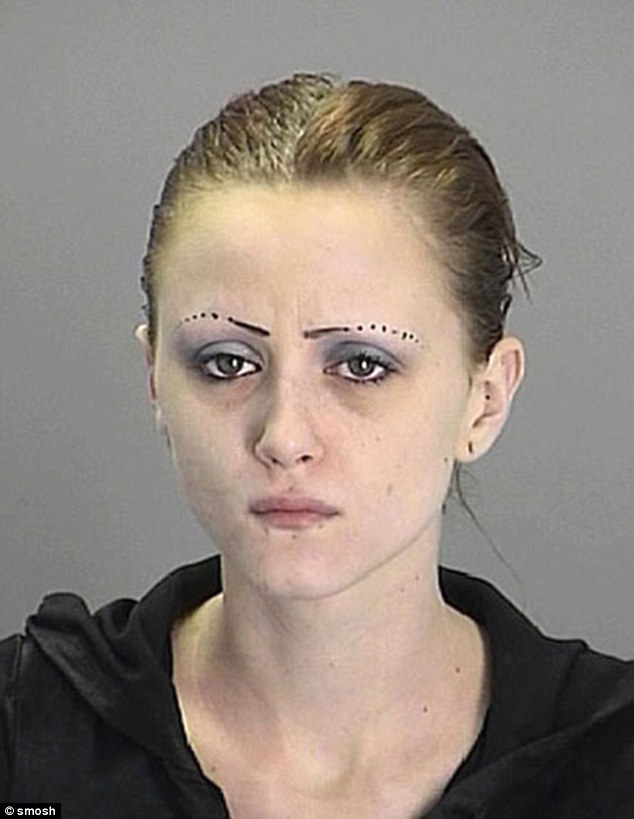 Giving up on her eyebrows halfway through, this female decided to draw dots instead