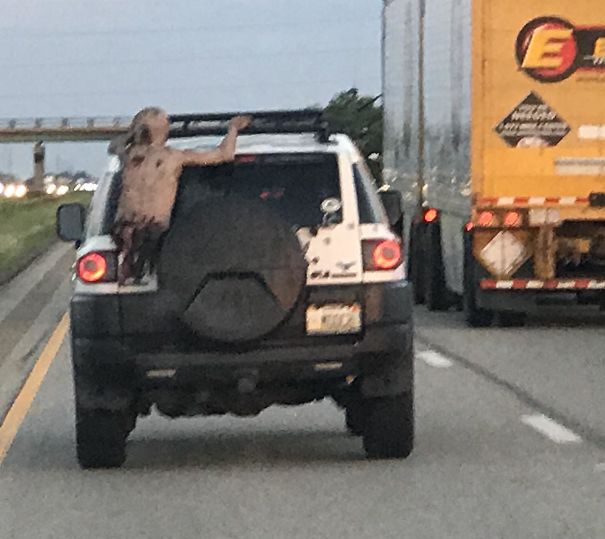 This Half-Zombie Clinging To The Back Of The Car In Front Of Me In Traffic