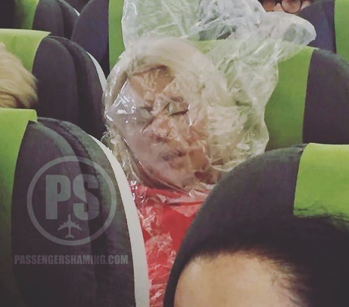 This Darwin Award Passenger Was Cold... So She Used The Plastic Bag (That Was Holding Blanket / Pillow) And Put It Over Her Head To Warm Up