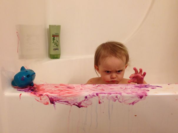 My Daughter Playing With A Toy Dolphin And Bath Paint